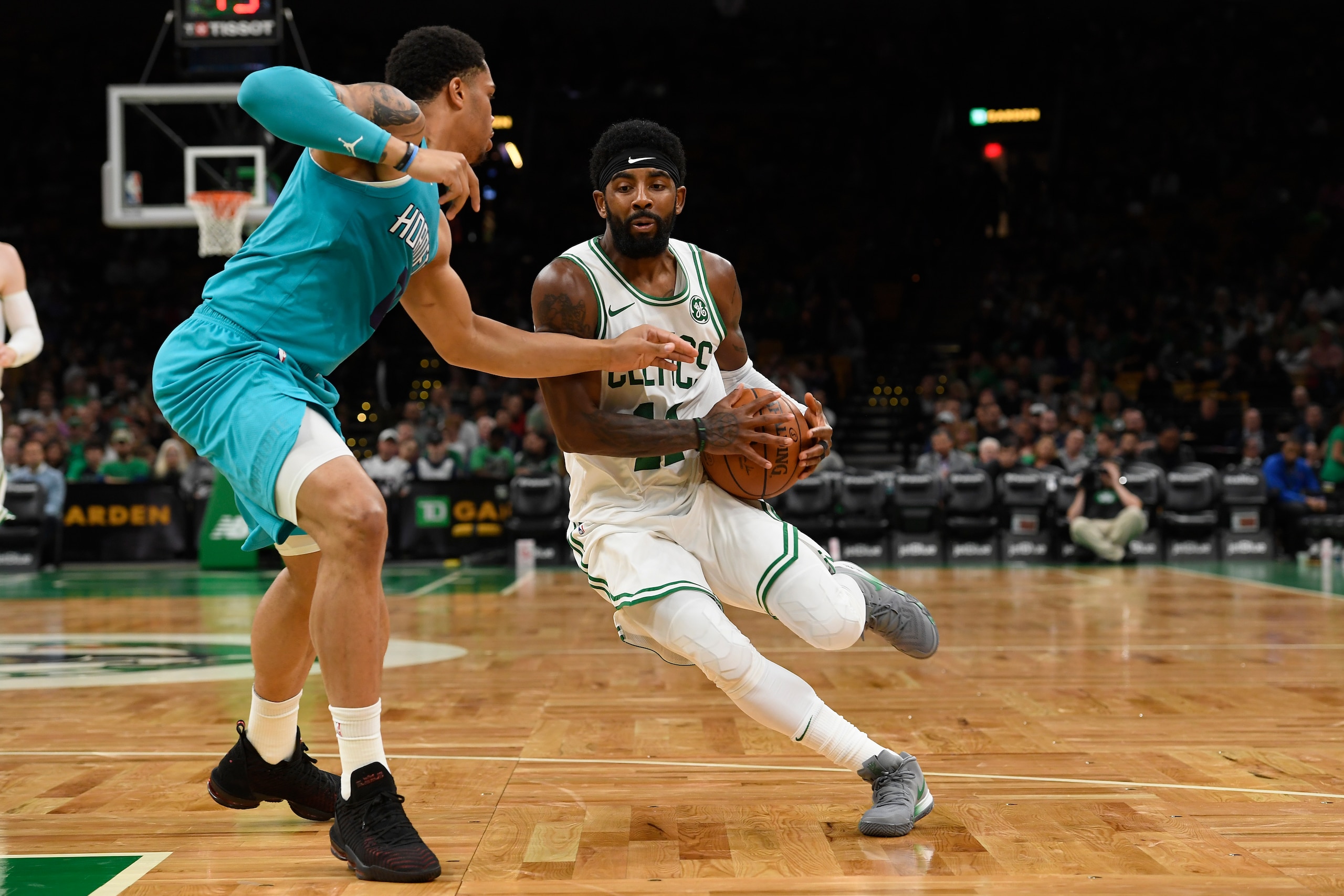 BOSTON, MA - SEPTEMBER 30: Kyrie Irving #11 of the Boston Celtics handles the ball against the Charlotte Hornets during a preseason game on September 30, 2018 at the TD Garden in Boston, Massachusetts. NOTE TO USER: User expressly acknowledges and agrees 