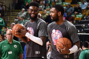 BOSTON, MA - NOVEMBER 10:  Jaylen Brown #7 of the Boston Celtics and Kyrie Irving #11 of the Boston Celtics speak before the game against the Charlotte Hornets on November 10, 2017 at the TD Garden in Boston, Massachusetts.  NOTE TO USER: User expressly a