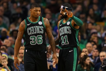 BOSTON, MA - DECEMBER 2: Kyrie Irving #11 of the Boston Celtics talks with Marcus Smart #36 during the first half against the Phoenix Suns at TD Garden on December 2, 2017 in Boston, Massachusetts. (Photo by Maddie Meyer/Getty Images)