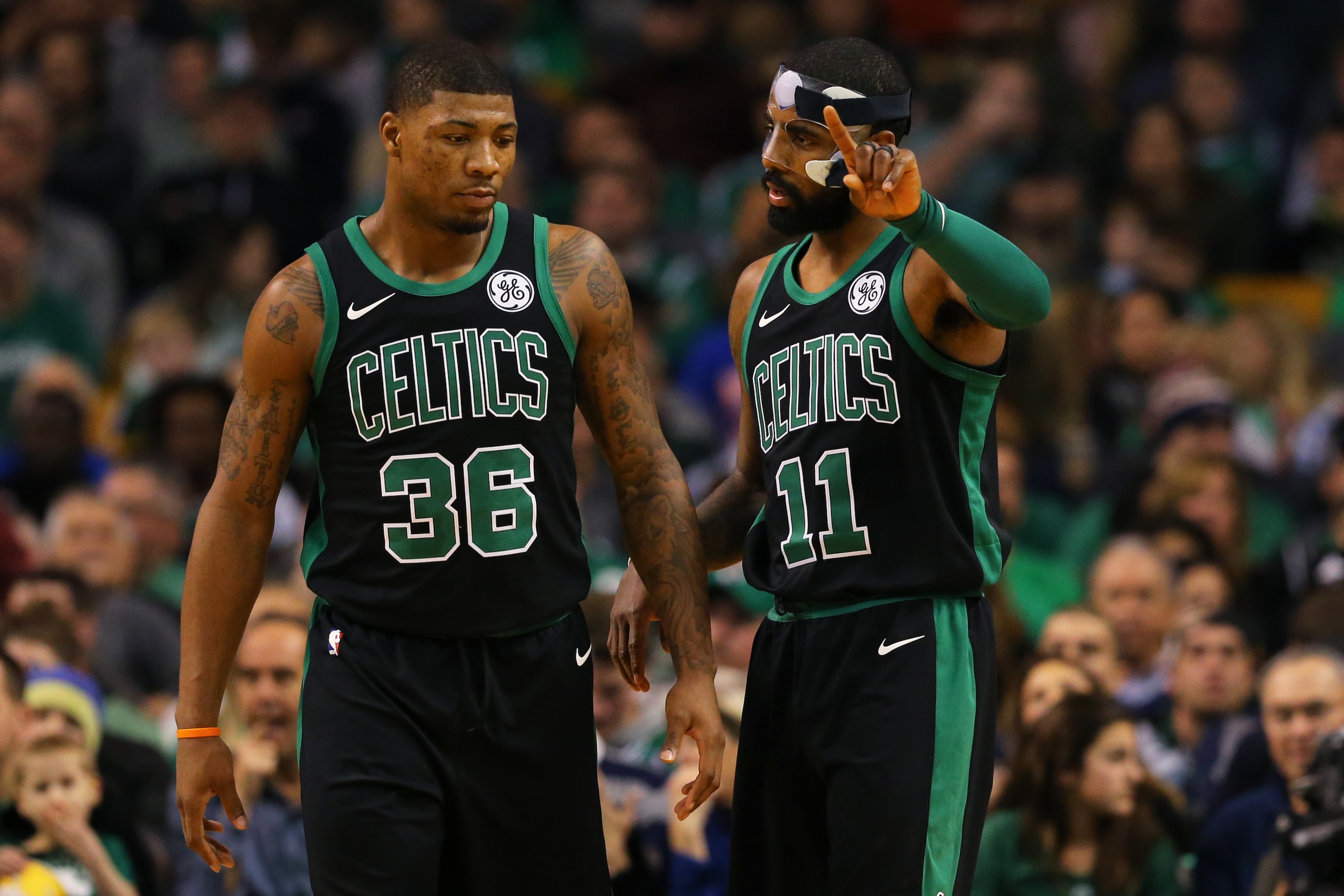 BOSTON, MA - DECEMBER 2: Kyrie Irving #11 of the Boston Celtics talks with Marcus Smart #36 during the first half against the Phoenix Suns at TD Garden on December 2, 2017 in Boston, Massachusetts. (Photo by Maddie Meyer/Getty Images)