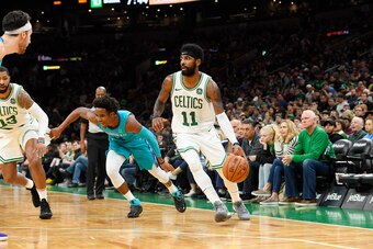 BOSTON, MA - SEPTEMBER 30: Kyrie Irving #11 of the Boston Celtics handles the ball against the Charlotte Hornets during a preseason game on September 30, 2018 at the TD Garden in Boston, Massachusetts. NOTE TO USER: User expressly acknowledges and agrees 