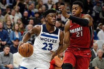 MINNEAPOLIS, MN - NOVEMBER 24: Jimmy Butler #23 of the Minnesota Timberwolves drives to the basket against Hassan Whiteside #21 of the Miami Heat during the game on November 24, 2017 at the Target Center in Minneapolis, Minnesota. NOTE TO USER: User expre