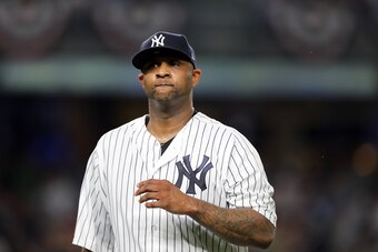 NEW YORK, NEW YORK - OCTOBER 09:  CC Sabathia #52 of the New York Yankees walks back to the dugout after giving up three runs in the third inning against the Boston Red Sox during Game Four American League Division Series at Yankee Stadium on October 09, 