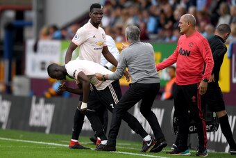 BURNLEY, ENGLAND - SEPTEMBER 02:  Jose Mourinho, Manager of Manchester United holds Eric Bailly of Manchester United as he replaces Paul Pogba of Manchester United during the Premier League match between Burnley FC and Manchester United at Turf Moor on Se