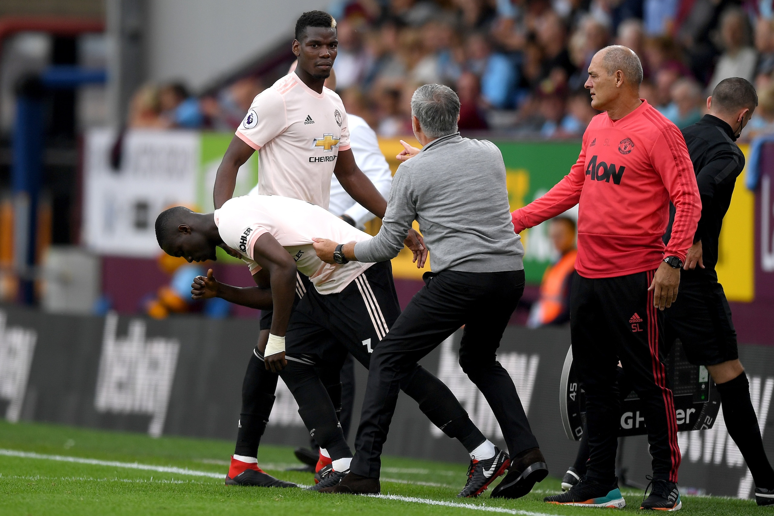 BURNLEY, ENGLAND - SEPTEMBER 02:  Jose Mourinho, Manager of Manchester United holds Eric Bailly of Manchester United as he replaces Paul Pogba of Manchester United during the Premier League match between Burnley FC and Manchester United at Turf Moor on Se