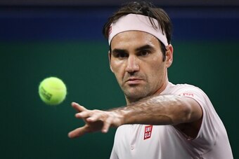 Switzerland's Roger Federer hits a return against Spain's Roberto Bautista Agut during their men's singles third round match at the Shanghai Masters tennis tournament on October 11, 2018. (Photo by WANG ZHAO / AFP)        (Photo credit should read WANG ZH