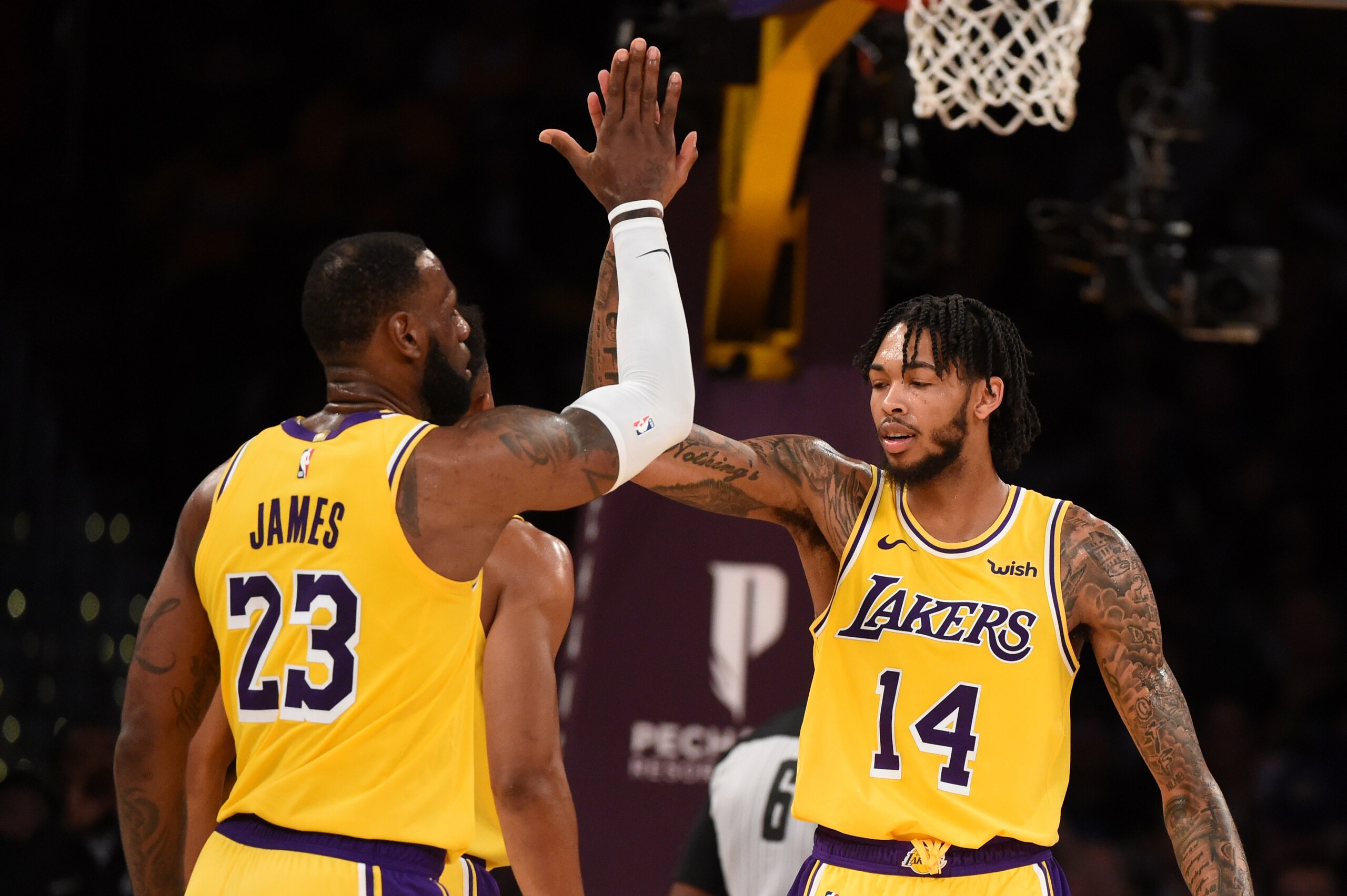 LOS ANGELES, CA - OCTOBER 4: LeBron James #23 and Brandon Ingram #14 of the Los Angeles Lakers react during a pre-season game against the Sacramento Kings on October 4, 2018 at Staples Center, in Los Angeles, California.  NOTE TO USER: User expressly ackn