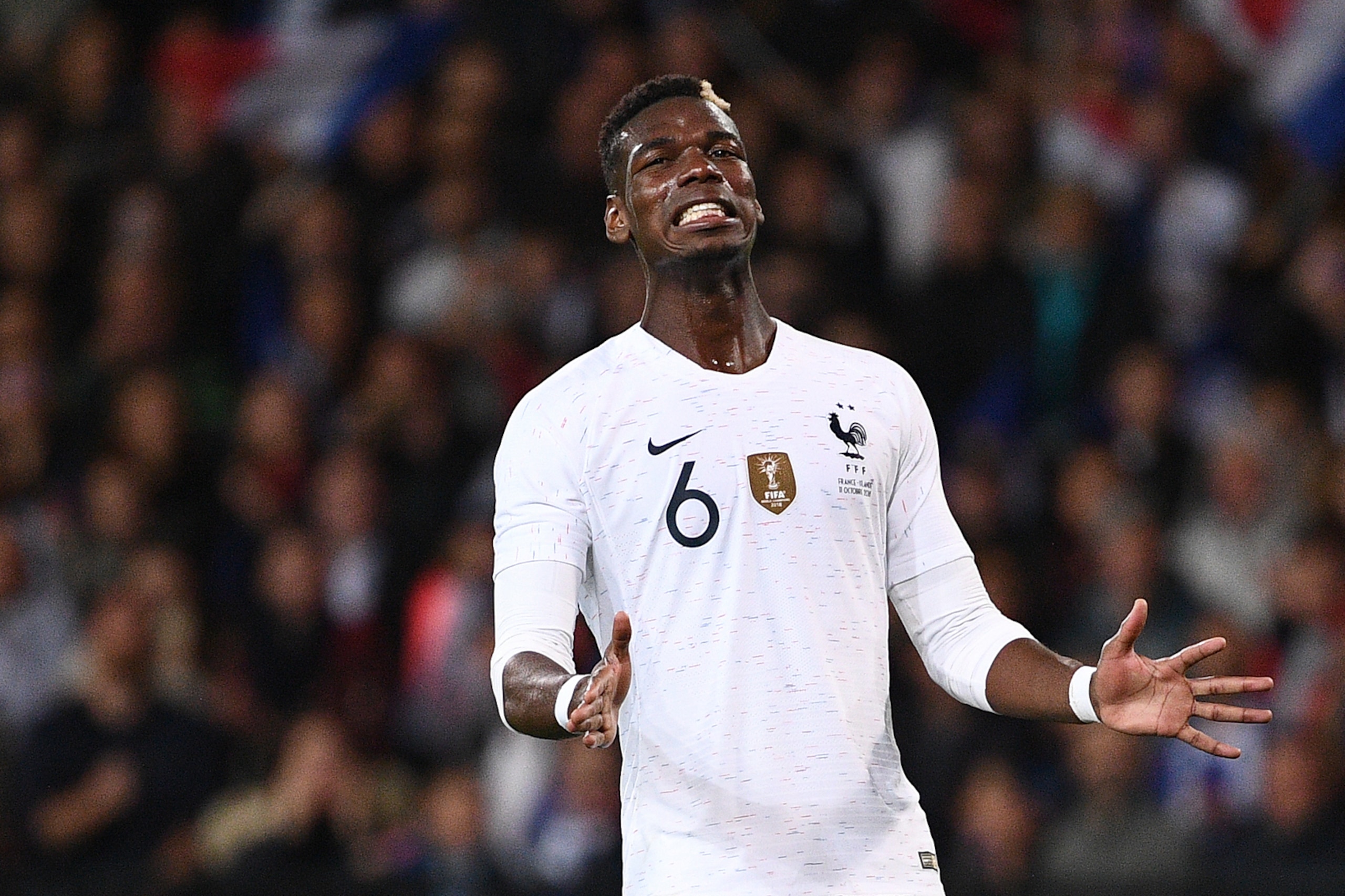 France's midfielder Paul Pogba grimaces during the friendly football match between France and Iceland at the Roudourou Stadium in Guingamp, western France on October 11, 2018. (Photo by FRANCK FIFE / AFP)        (Photo credit should read FRANCK FIFE/AFP/G