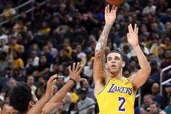 LAS VEGAS, NEVADA - OCTOBER 10:  Lonzo Ball #2 of the Los Angeles Lakers shoots against Quinn Cook #4 of the Golden State Warriors during their preseason game at T-Mobile Arena on October 10, 2018 in Las Vegas, Nevada. The Lakers defeated the Warriors 123