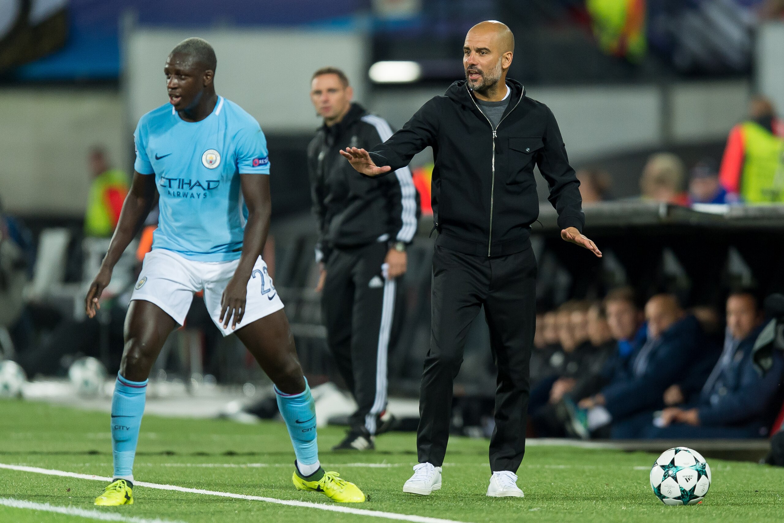 ROTTERDAM, NETHERLANDS - SEPTEMBER 13: Benjamin Mendy of Manchester City and Head coach Pep Guardiola of Manchester City looks on during the UEFA Champions League match between Feyenoord Rotterdam and Manchester City at Stadion Feijenoord on September 13,