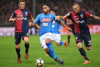 GENOA, ITALY - OCTOBER 25: Player of SSC Napoli Faouzi Ghoulam vies with Genoa CFC players Darko Lazovic and Luca Rigoni during the Serie A match between Genoa CFC and SSC Napoli at Stadio Luigi Ferraris on October 25, 2017 in Genoa, Italy.  (Photo by Fra