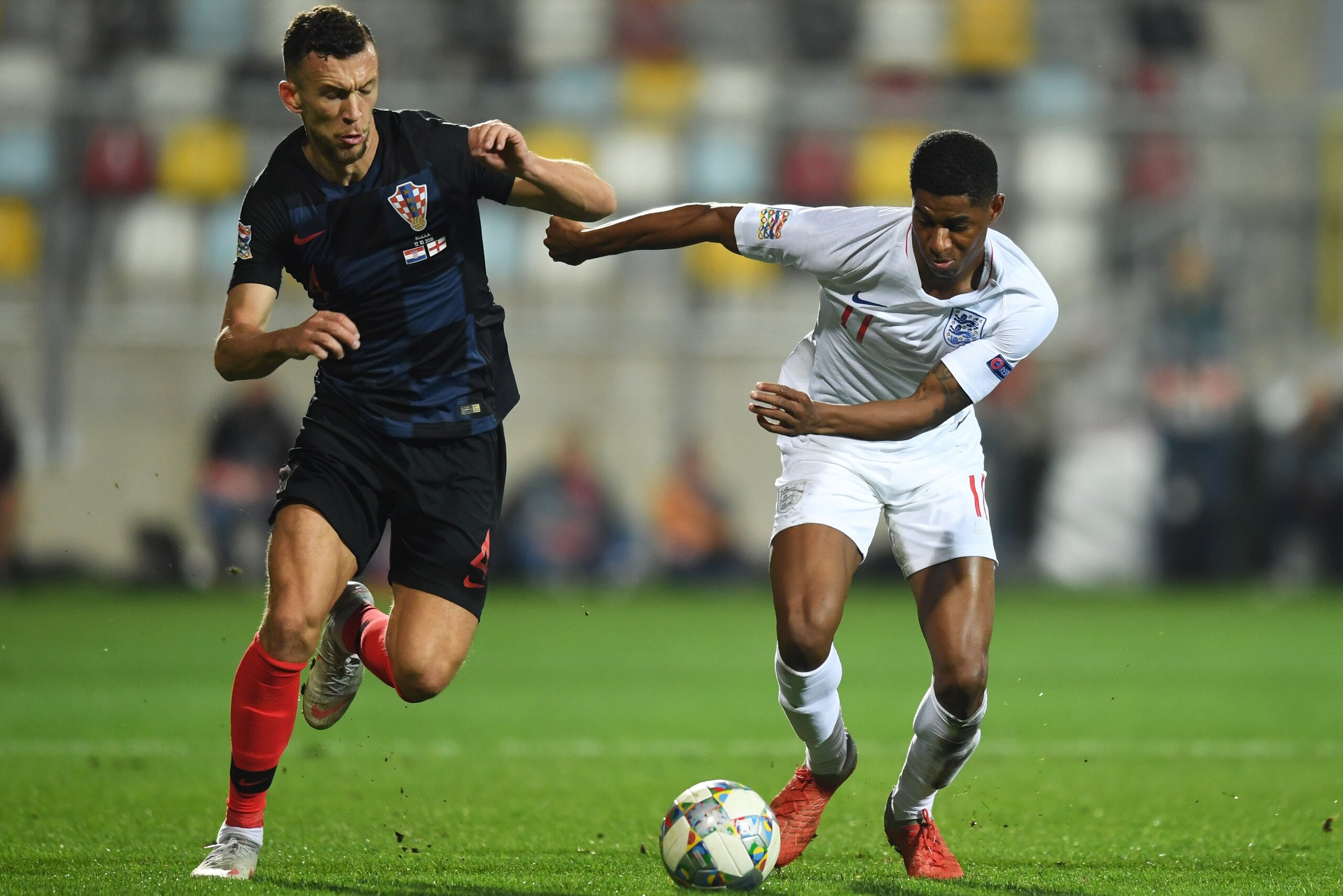 RIJEKA, CROATIA - OCTOBER 12:  Ivan Perisic of Croatia and Marcus Rashford of England battle for the ball during the UEFA Nations League A Group Four match between Croatia and England at Stadion HNK Rijeka on October 12, 2018 in Rijeka, Croatia. The match