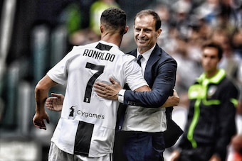 TURIN, ITALY - SEPTEMBER 16:  (EDITORS NOTE: This image was altered using a digital filter) Cristiano Ronaldo of Juventus (L) and head coach Juventus Massimiliano Allegri celebrate after scoring the opening goal during the serie A match between Juventus a