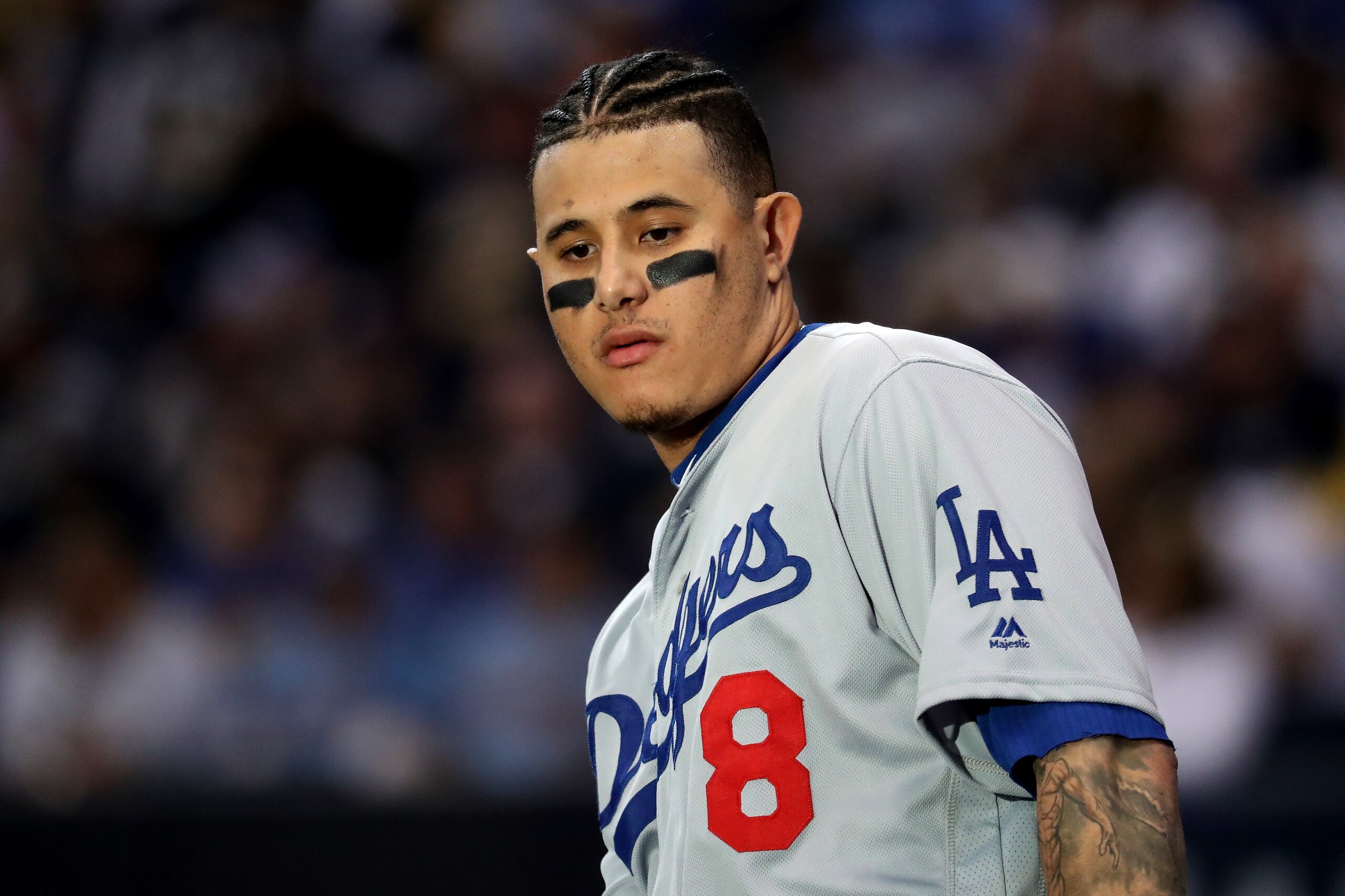 MILWAUKEE, WI - OCTOBER 13: Manny Machado #8 of the Los Angeles Dodgers looks on against the Milwaukee Brewers in Game Two of the National League Championship Series at Miller Park on October 13, 2018 in Milwaukee, Wisconsin. (Photo by Rob Carr/Getty Im MILWAUKEE, WI - OCTOBER 13: Manny Machado #8 of the Los Angeles Dodgers looks on against the Milwaukee Brewers in Game Two of the National League Championship Series at Miller Park on October 13, 2018 in Milwaukee, Wisconsin. (Photo by Rob Carr/Getty Im