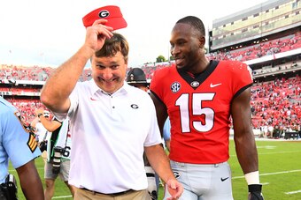 ATHENS, GA - SEPTEMBER 29: Head Coach Kirby Smart of the Georgia Bulldogs heads off the field with DAndre Walker #15 after the game against the Tennessee Volunteers on September 29, 2018 at Sanford Stadium in Athens, Georgia. (Photo by Scott Cunningham/Ge
