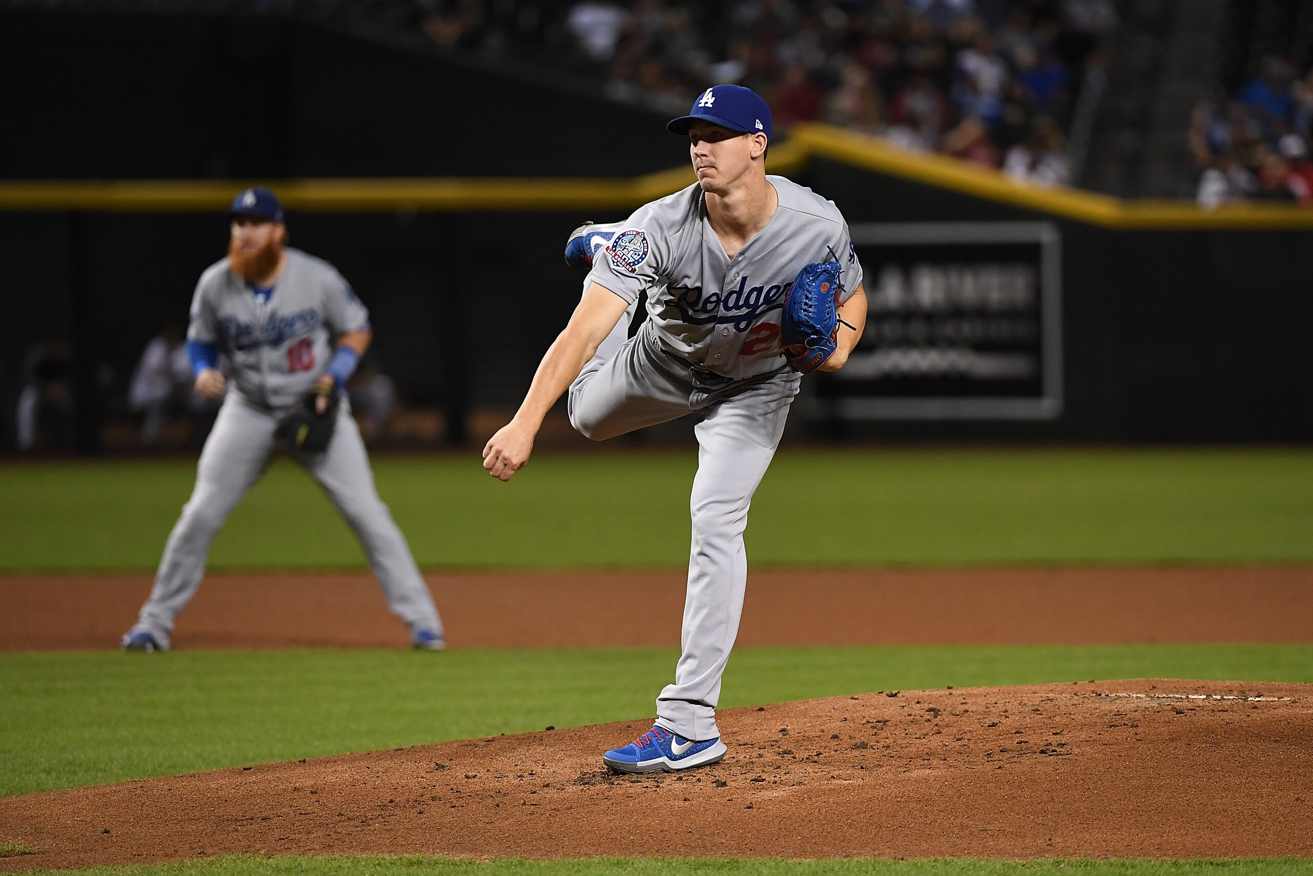PHOENIX, AZ - SEPTEMBER 25:  Walker Buehler #21 of the Los Angeles Dodgers delivers a pitch against the Arizona Diamondbacks at Chase Field on September 25, 2018 in Phoenix, Arizona.  (Photo by Norm Hall/Getty Images)