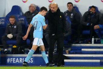 LEICESTER, ENGLAND - DECEMBER 19: Pep Guardiola the head coach / manager of Manchester City and Phil Foden of Manchester City during the Carabao Cup Quarter-Final match between Leicester City and Manchester City at The King Power Stadium on December 19, 2