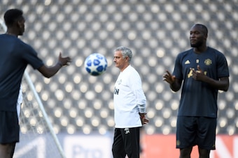 (From L) Manchester United's French midfielder Paul Pogba, Portuguese manager Jose Mourinho and Belgian striker Romelu Lukaku attend a training session on the eve of the UEFA Champions League group stage H football match between Young Boys and Manchester 