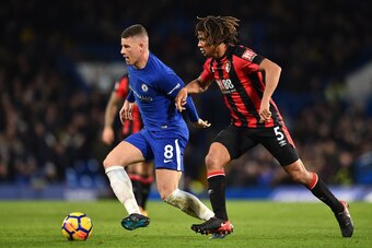 Chelsea's English midfielder Ross Barkley (L) vies with Bournemouth's Dutch defender Nathan Ake during the English Premier League football match between Chelsea and Bournemouth at Stamford Bridge in London on January 31, 2018. / AFP PHOTO / Glyn KIRK / RE