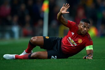 MANCHESTER, ENGLAND - OCTOBER 02:  Antonio Valencia of Manchester United lies on the pitch during the Group H match of the UEFA Champions League between Manchester United and Valencia at Old Trafford on October 2, 2018 in Manchester, United Kingdom.  (Pho