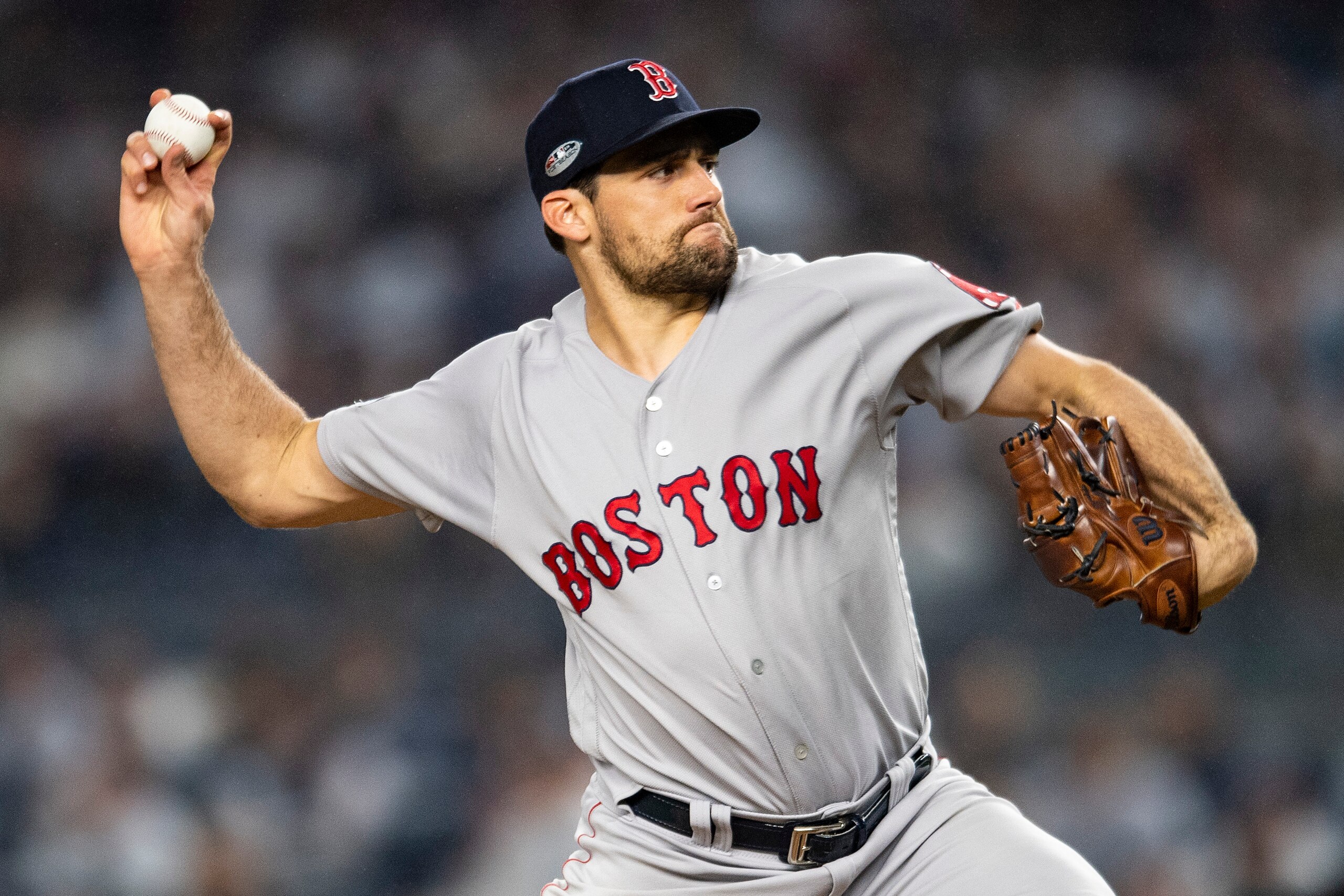 NEW YORK, NY - OCTOBER 8: Nathan Eovaldi #17 of the Boston Red Sox delivers during the first inning of game three of the American League Division Series against the New York Yankees on October 8, 2018 at Yankee Stadium in the Bronx borough of New York Cit