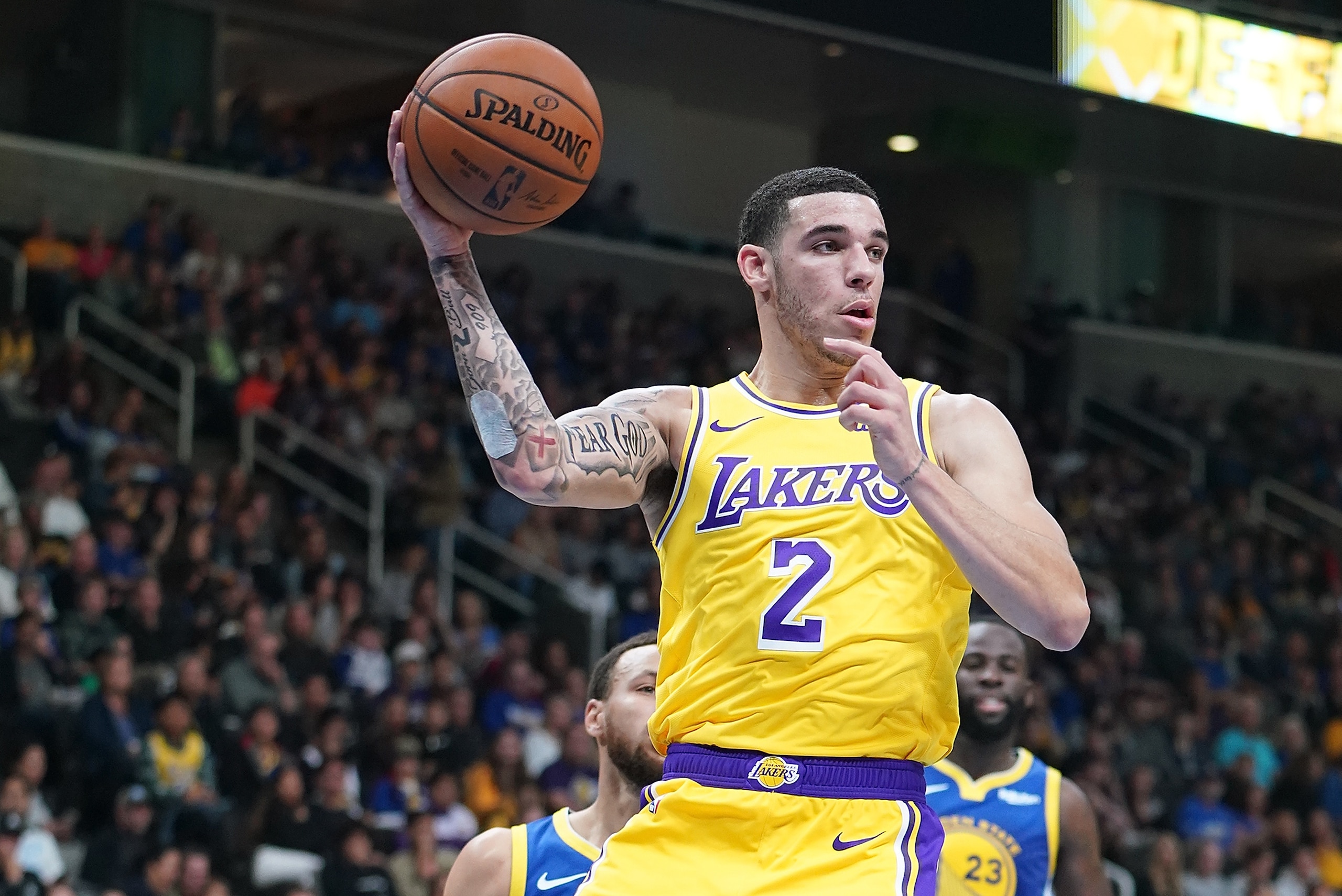 SAN JOSE, CA - OCTOBER 12:  Lonzo Ball #2 of the Los Angeles Lakers looks to pass the ball against the Golden State Warriors during the first half of their NBA basketball game at SAP Center on October 12, 2018 in San Jose, California. NOTE TO USER: User e