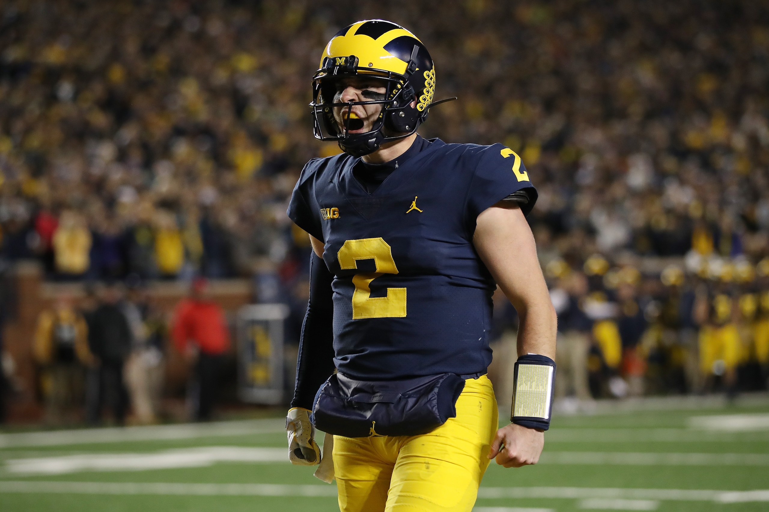 ANN ARBOR, MI - OCTOBER 13: Shea Patterson #2 of the Michigan Wolverines reacts to a a Karan Higdon #22 first half touchdown while playing the Wisconsin Badgers on October 13, 2018 at Michigan Stadium in Ann Arbor, Michigan. (Photo by Gregory Shamus/Getty