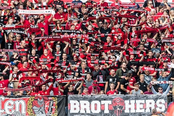 (L-R) supporters of Bayer 04 Leverkusen DFL REGULATIONS PROHIBIT ANY USE OF PHOTOGRAPHS AS IMAGE SEQUENCES AND/OR QUASI-VIDEO during the Bundesliga match between Bayer 04 Leverkusen and VFL Wolfsburg at the BayArena,  on September 01, 2018 in Leverkusen, 