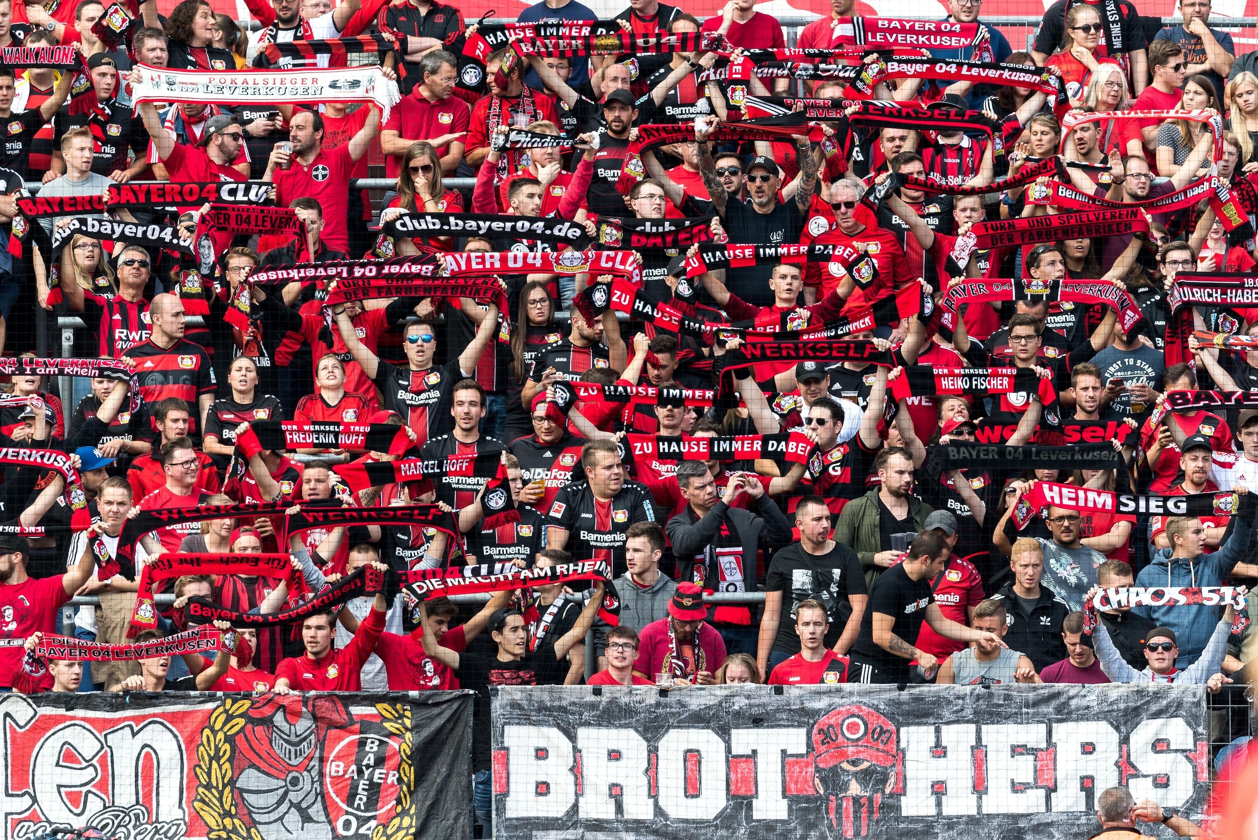 (L-R) supporters of Bayer 04 Leverkusen DFL REGULATIONS PROHIBIT ANY USE OF PHOTOGRAPHS AS IMAGE SEQUENCES AND/OR QUASI-VIDEO during the Bundesliga match between Bayer 04 Leverkusen and VFL Wolfsburg at the BayArena,  on September 01, 2018 in Leverkusen, 