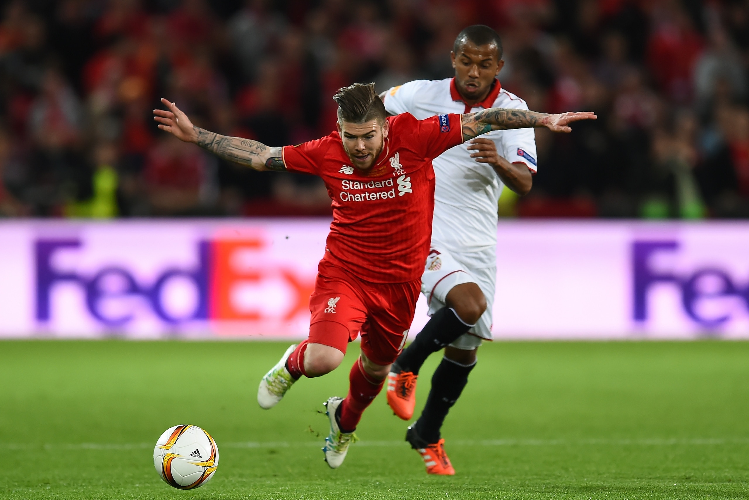 BASEL, SWITZERLAND - MAY 18: Alberto Moreno of Liverpool is challenged by Mariano of Sevilla during the UEFA Europa League Final match between Liverpool and Sevilla at St. Jakob-Park on May 18, 2016 in Basel, Switzerland.  (Photo by David Ramos/Getty Imag