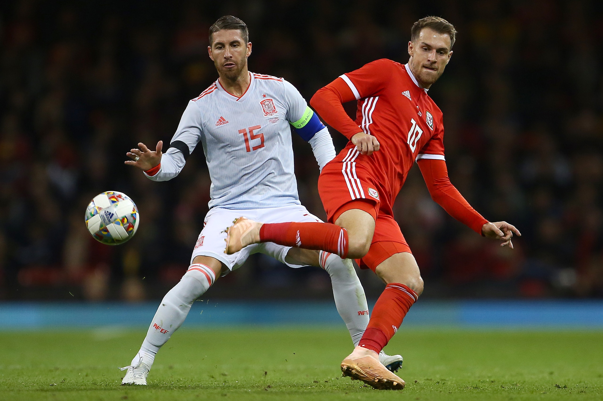 Spain's defender Sergio Ramos (L) vies with Wales' midfielder Aaron Ramsey during the international friendly football match between Wales and Spain at The Principality Stadium in Cardiff, south Wales, on October 11, 2018. (Photo by GEOFF CADDICK / AFP) Spain's defender Sergio Ramos (L) vies with Wales' midfielder Aaron Ramsey during the international friendly football match between Wales and Spain at The Principality Stadium in Cardiff, south Wales, on October 11, 2018. (Photo by GEOFF CADDICK / AFP)