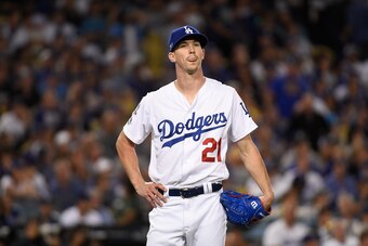 LOS ANGELES, CA - OCTOBER 15:  Pitcher Walker Buehler #21 of the Los Angeles Dodgers reacts after giving up a two-run home run during the seventh inning of Game Three of the National League Championship Series against the Milwaukee Brewers at Dodger Stadi