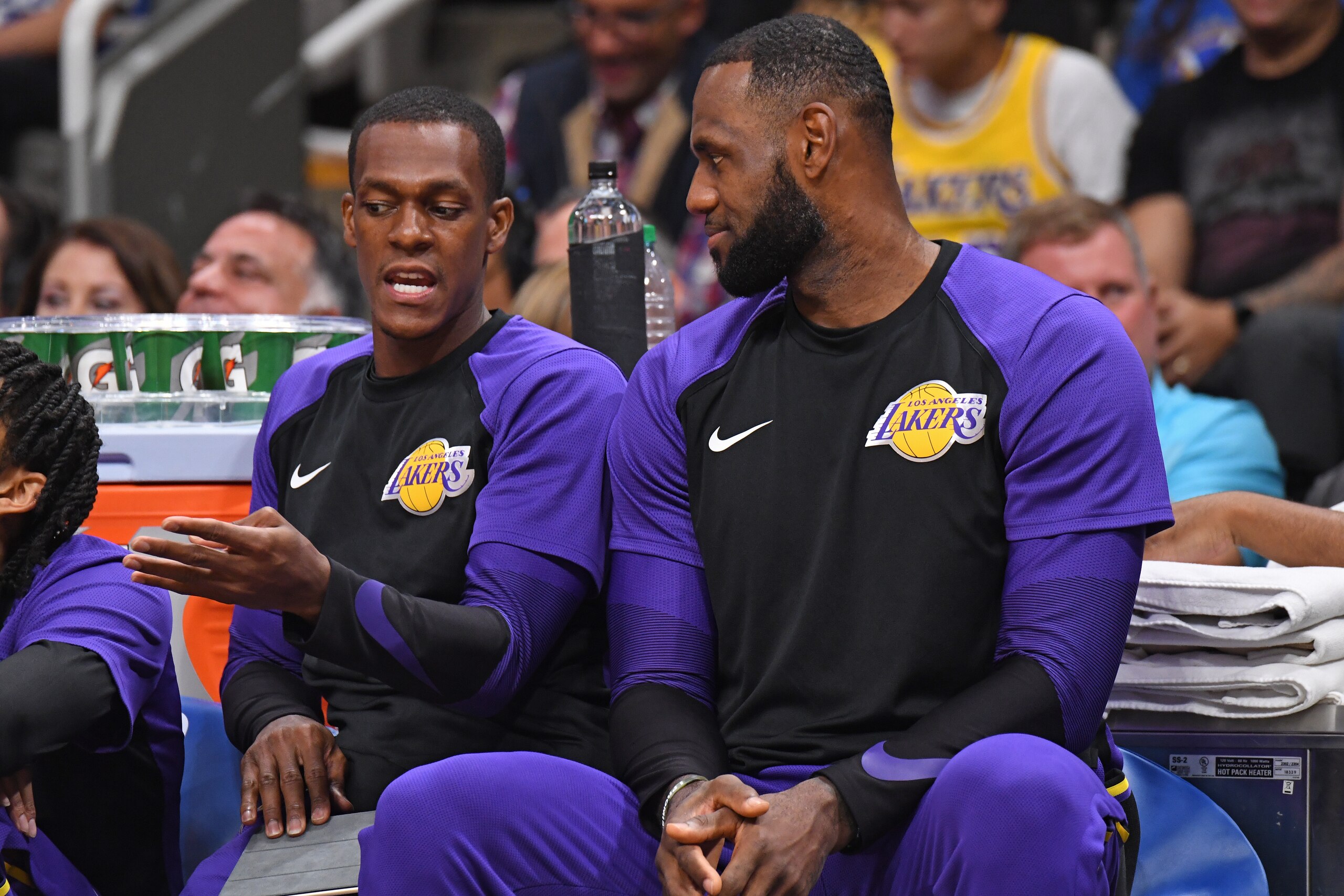 SAN JOSE, CA - OCTOBER 12: Rajon Rondo #9 and LeBron James #23 of the Los Angeles Lakers talk on the bench during a pre-season game against the Golden State Warriors on October 12, 2018 at the SAP Center in San Jose, California. NOTE TO USER: User express