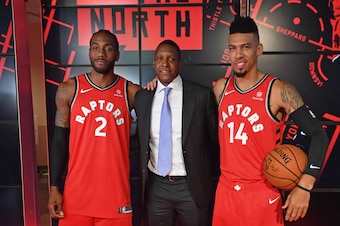 TORONTO, ON - SEPTEMBER 24: Kawhi Leonard #2, Masai Ujiri and Danny Green #14 of the Toronto Raptors pose for a portrait at a press conference after media day on September 24, 2018 at the Air Canada Centre in Toronto, Ontario, Canada. NOTE TO USER: User e