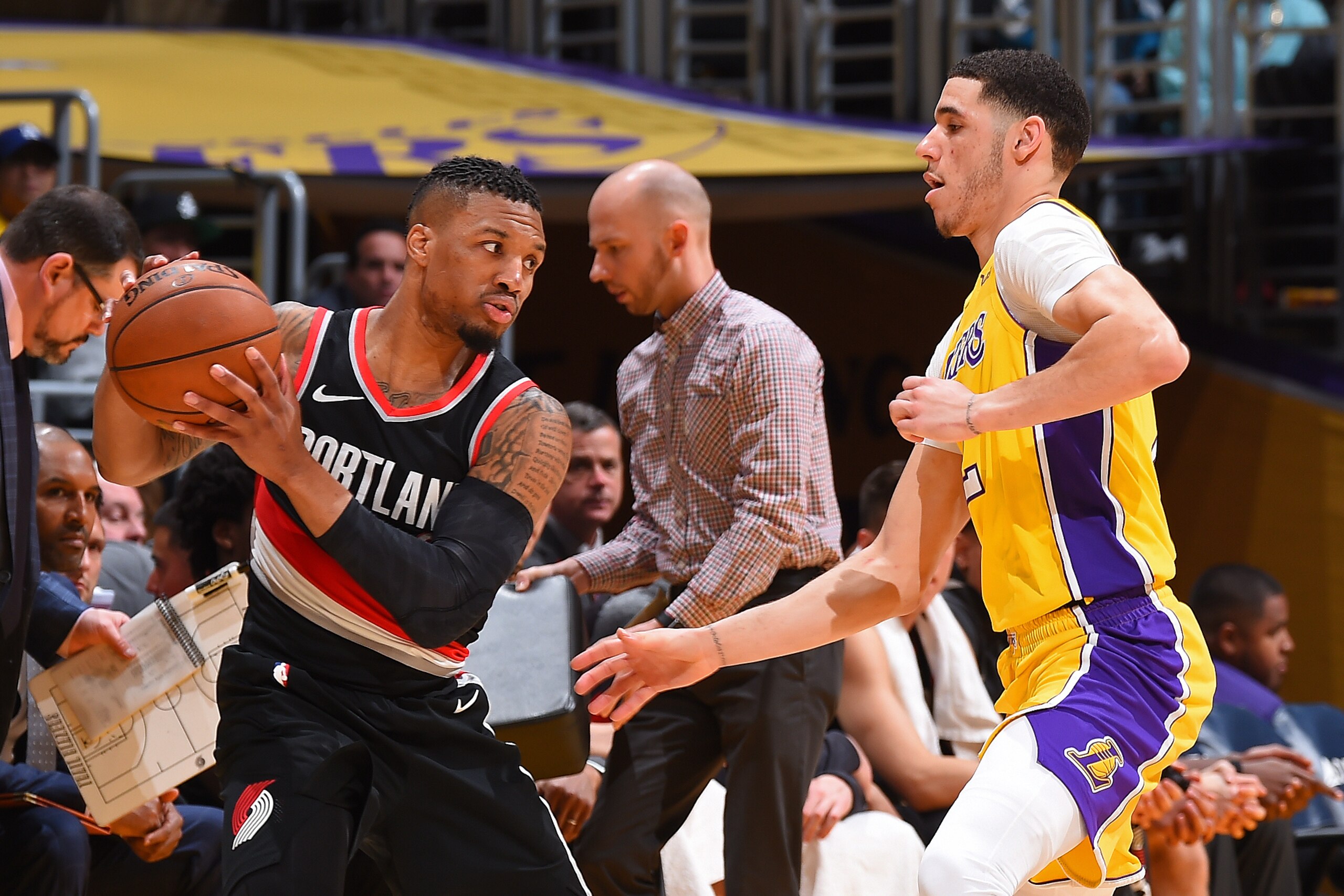 LOS ANGELES, CA - MARCH 5: Damian Lillard #0 of the Portland Trail Blazers handles the ball against Lonzo Ball #2 of the Los Angeles Lakers during the game between the two teams on March 5, 2018 at STAPLES Center in Los Angeles, California. NOTE TO USER: 