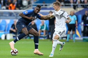 PARIS, FRANCE - OCTOBER 16: Paul Pogba of France, Toni Kroos of Germany during the UEFA Nations League A group one match between France and Germany at Stade de France on October 16, 2018 in Paris, France. (Photo by Jean Catuffe/Getty Images)