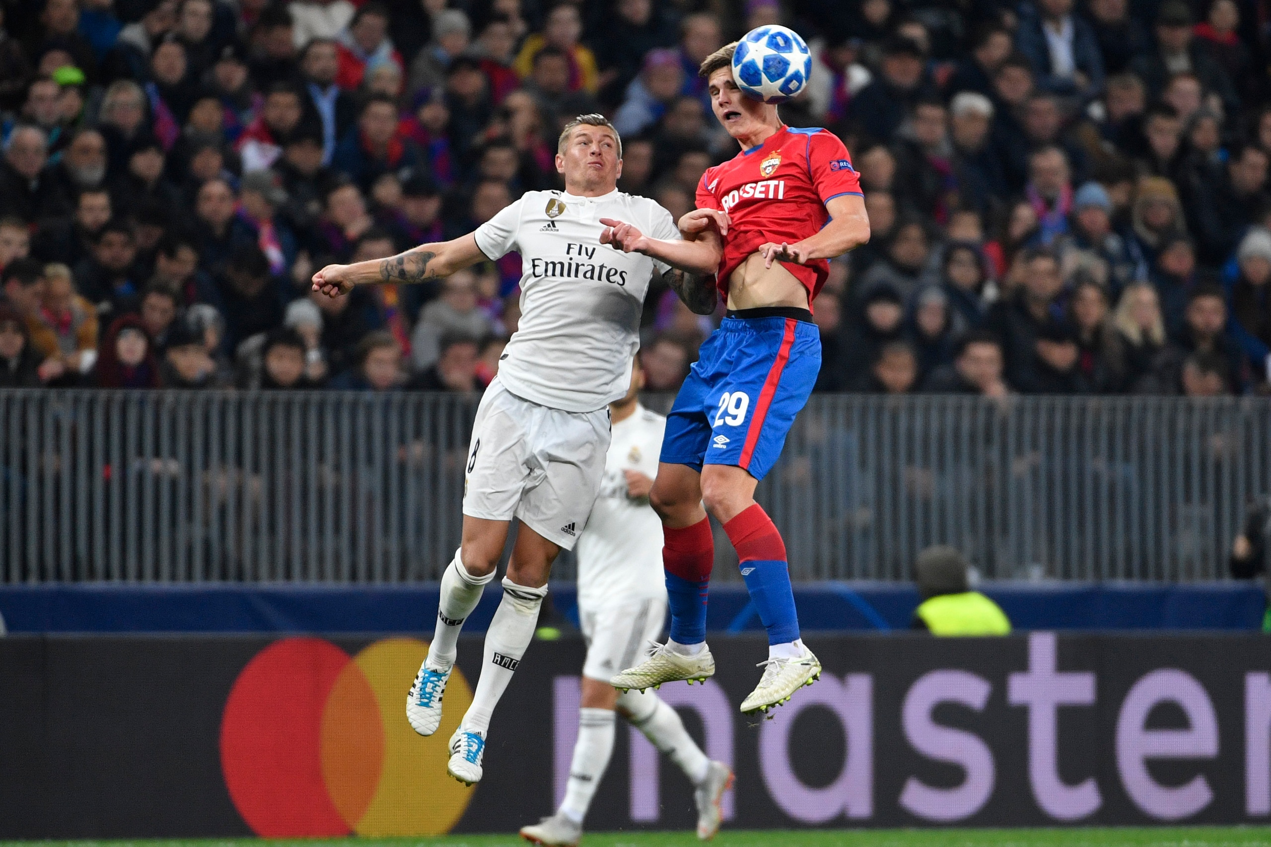 Real Madrid's German midfielder Toni Kroos (L) and CSKA Moscow's Slovenian midfielder Jaka Bijol vie for the ball during the UEFA Champions League group G football match between PFC CSKA Moscow and Real Madrid CF at the Luzhniki stadium in Moscow on Octob