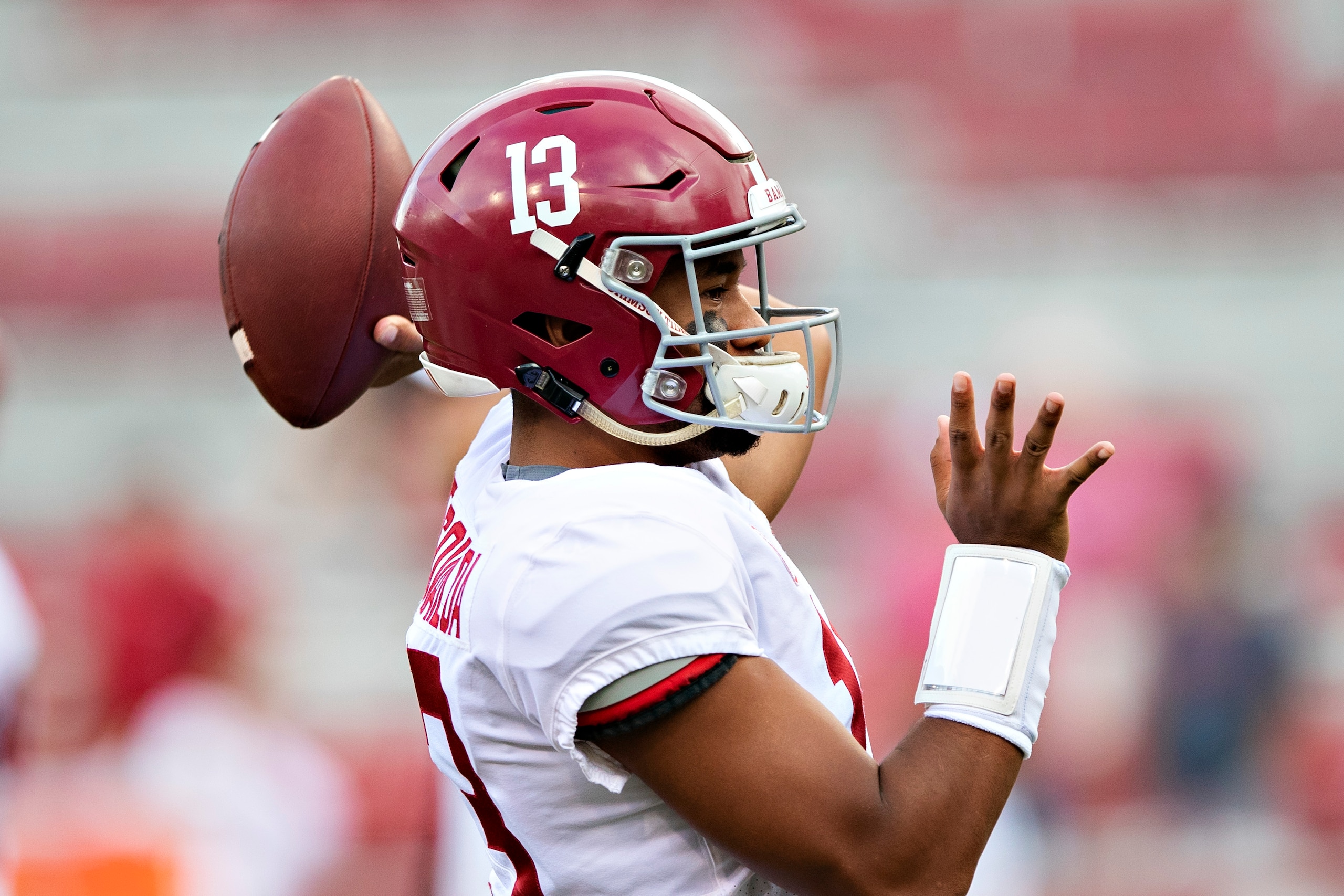 FAYETTEVILLE, AR - OCTOBER 6:  Tua Tagovailoa #13 of the Alabama Crimson Tide warms up before a game against the Arkansas Razorbacks at Razorback Stadium on October 6, 2018 in Tuscaloosa, Alabama.  The Crimson Tide defeated the Razorbacks 65-31.  (Photo b