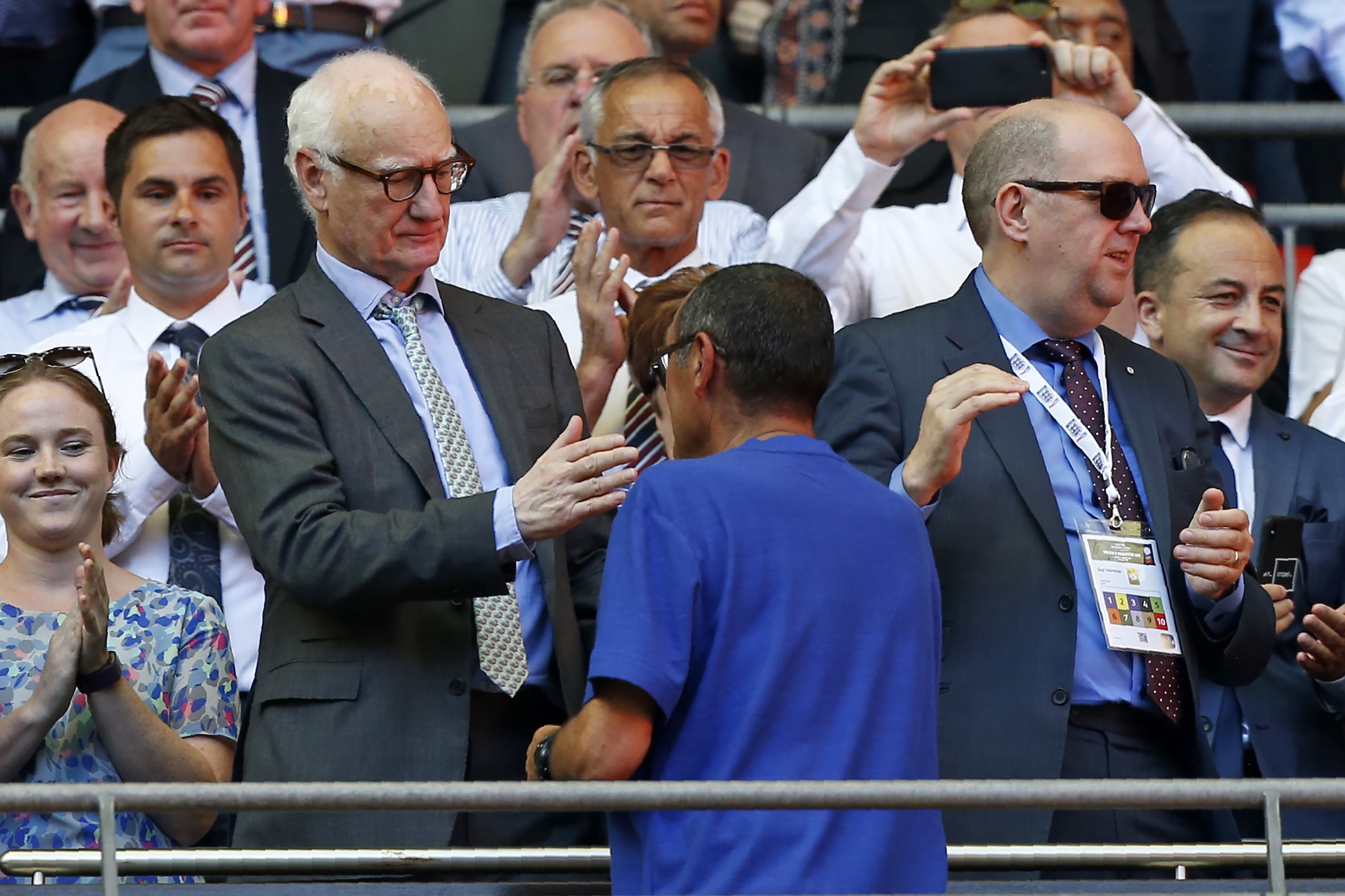Chelsea's Italian head coach Maurizio Sarri shakes hands with Chelsea's US chairman Bruce Buck (L) after the English FA Community Shield football match between Chelsea and Manchester City at Wembley Stadium in north London on August 5, 2018. - Manchester 