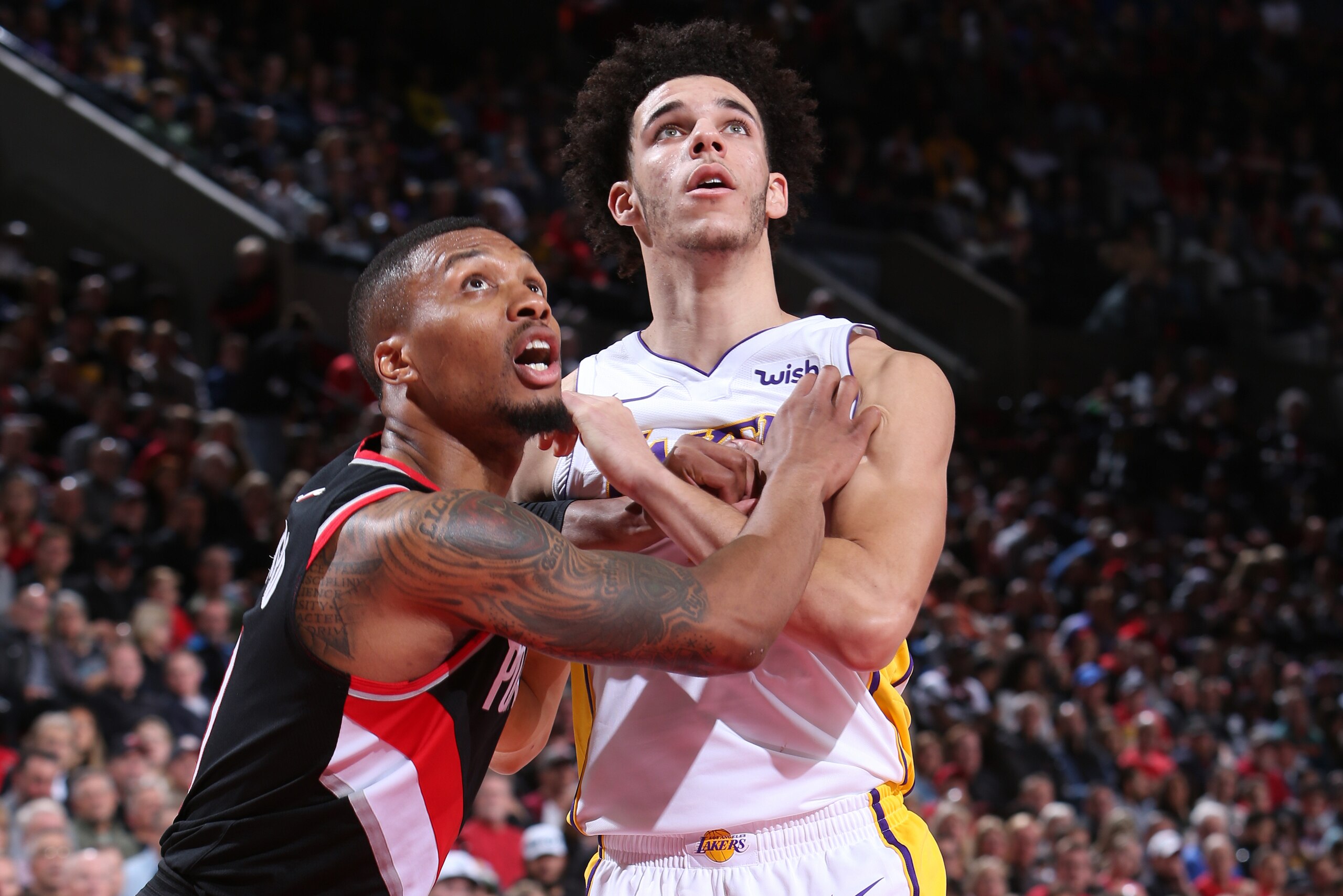 PORTLAND, OR - NOVEMBER 2: Damian Lillard #0 of the Portland Trail Blazers battles for position against Lonzo Ball #2 of the Los Angeles Lakers on November 2, 2017 at the Moda Center in Portland, Oregon. NOTE TO USER: User expressly acknowledges and agree