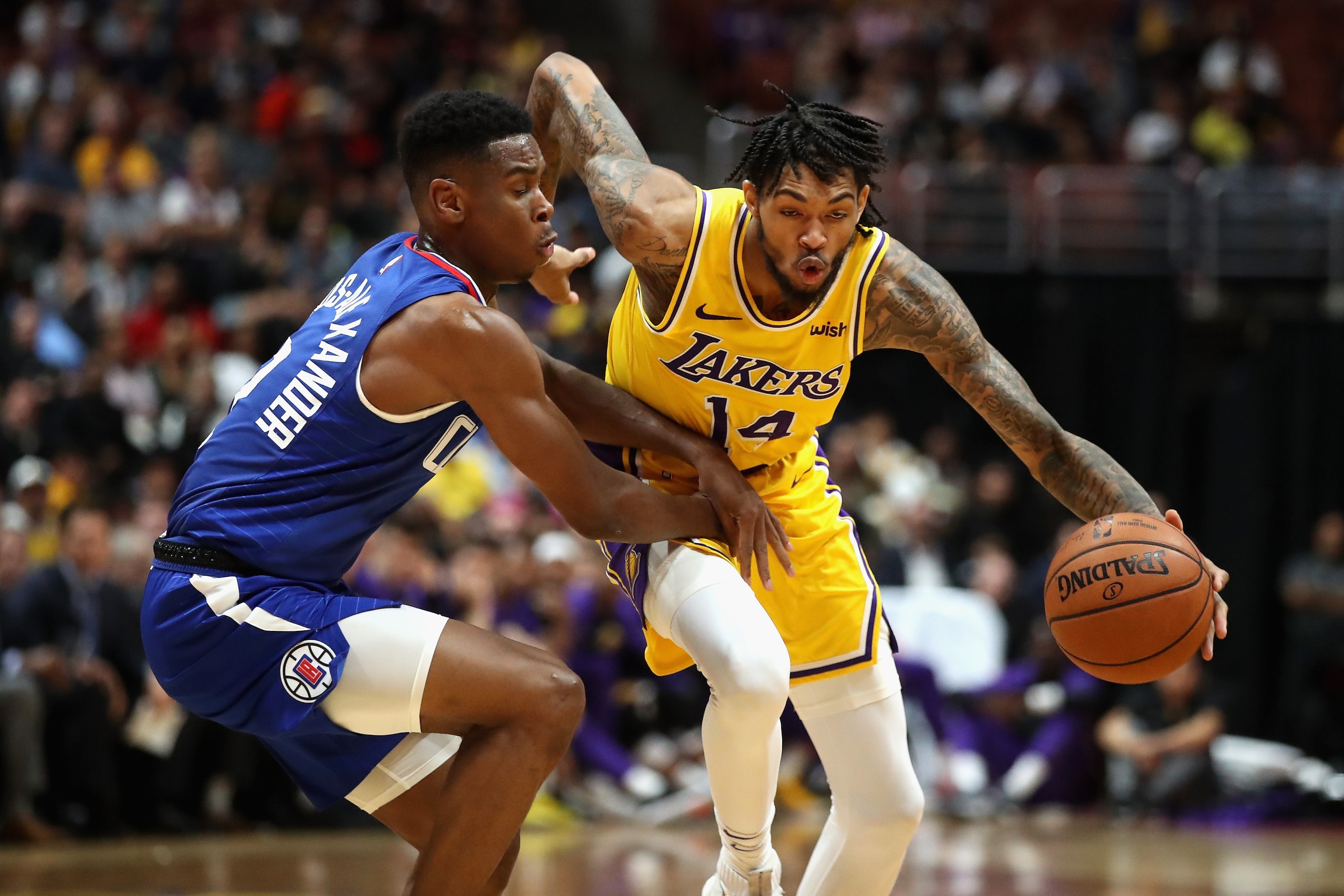 ANAHEIM, CA - OCTOBER 06:  Shai Gilgeous-Alexander #2 of the LA Clippers defends against Brandon Ingram #14 of the Los Angeles Lakers during the second half of a NBA preseason game at Honda Center on October 6, 2018 in Anaheim, California.  NOTE TO USER: 