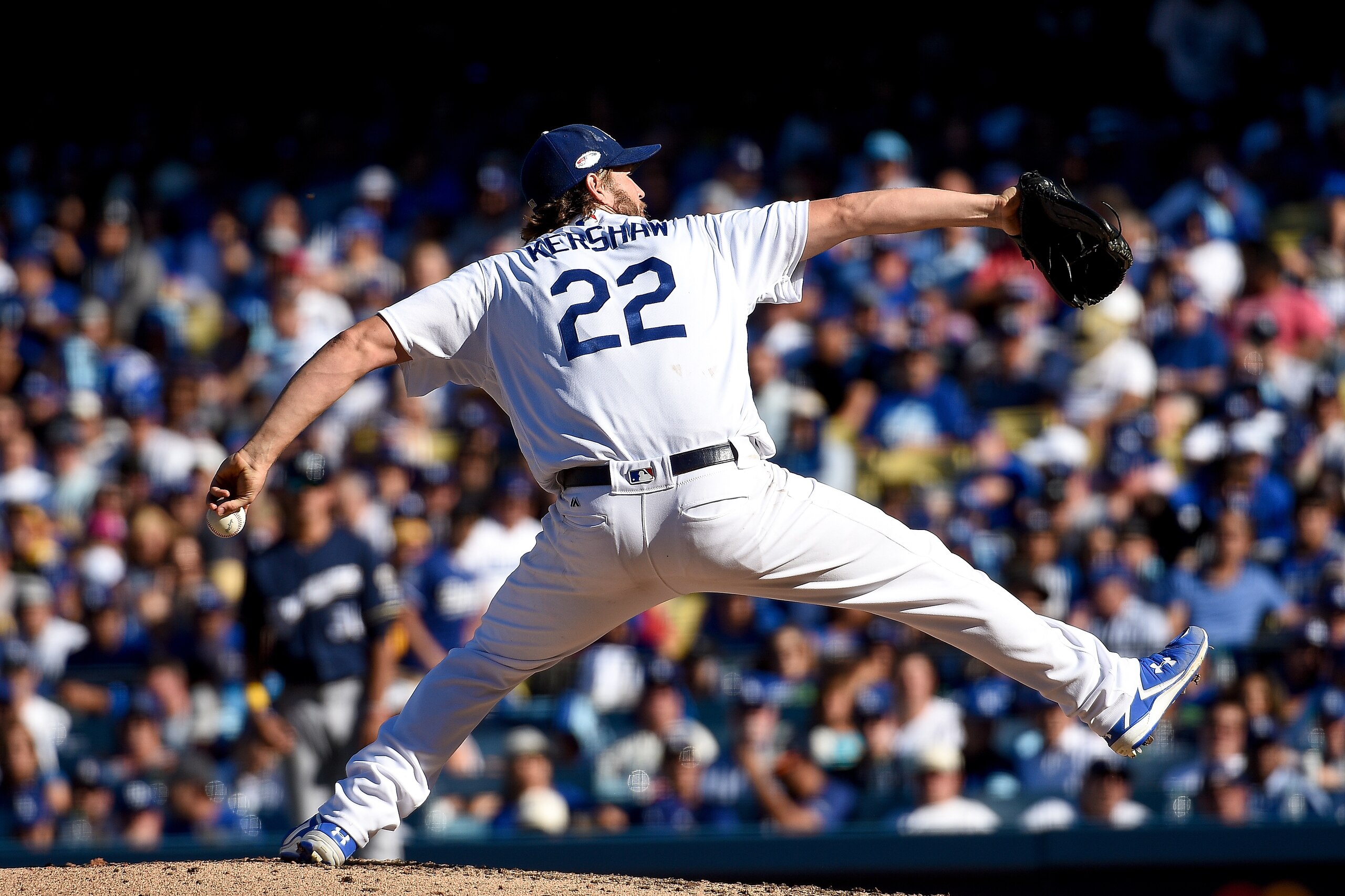 LOS ANGELES, CA - OCTOBER 17:  Clayton Kershaw #22 of the Los Angeles Dodgers delivers a pitch in the fourth inning against the Milwaukee Brewers in Game Five of the National League Championship Series at Dodger Stadium on October 17, 2018 in Los Angeles,