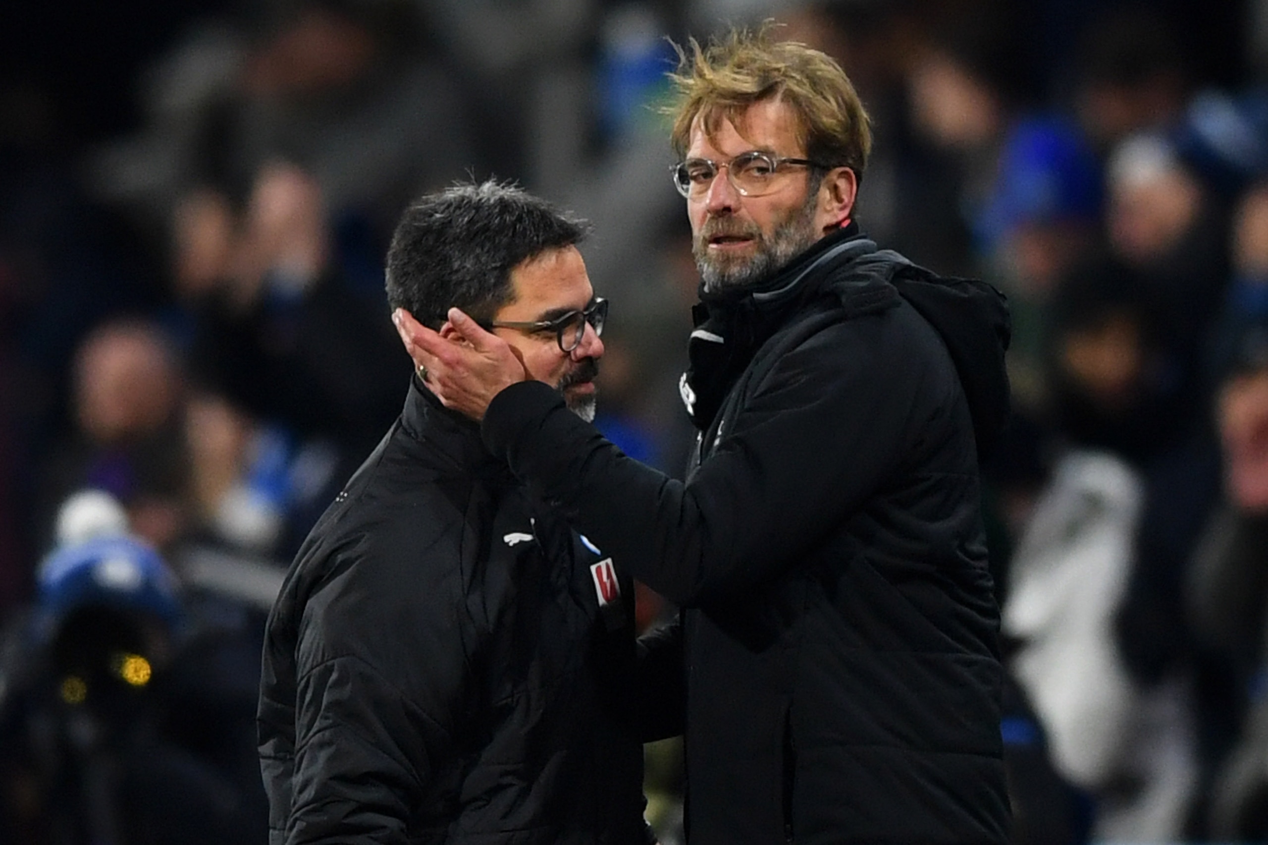 HUDDERSFIELD, ENGLAND - JANUARY 30:  Jurgen Klopp, Manager of Liverpool (R) and David Wagner, Manager of Huddersfield Town embrace after the Premier League match between Huddersfield Town and Liverpool at John Smith's Stadium on January 30, 2018 in Hudder