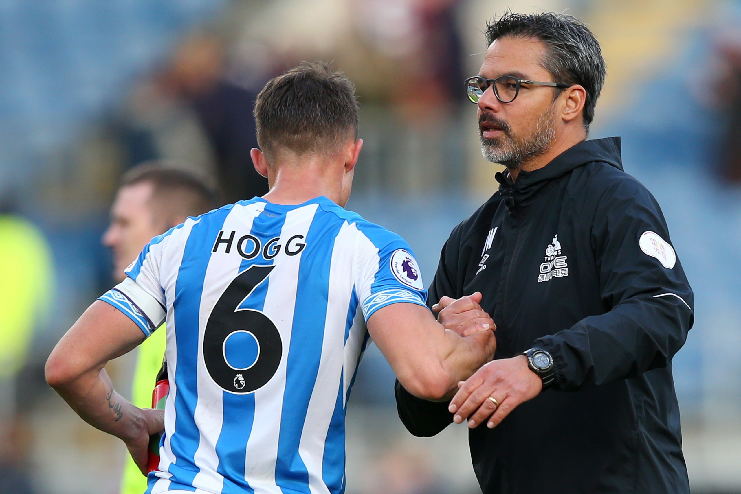 BURNLEY, ENGLAND - OCTOBER 06:  David Wagner, manager of Huddersfield Town speaks with Jonathan Hogg of Huddersfield Town after the Premier League match between Burnley FC and Huddersfield Town at Turf Moor on October 6, 2018 in Burnley, United Kingdom.  
