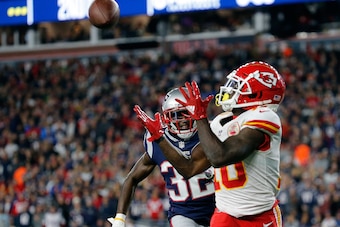 FOXBOROUGH, MA - OCTOBER 14: Tyreek Hill #10 of the Kansas City Chiefs catches a touchdown pass against the defense of Devin McCourty #32 of the New England Patriots in the third quarter at Gillette Stadium on October 14, 2018 in Foxborough, Massachusetts