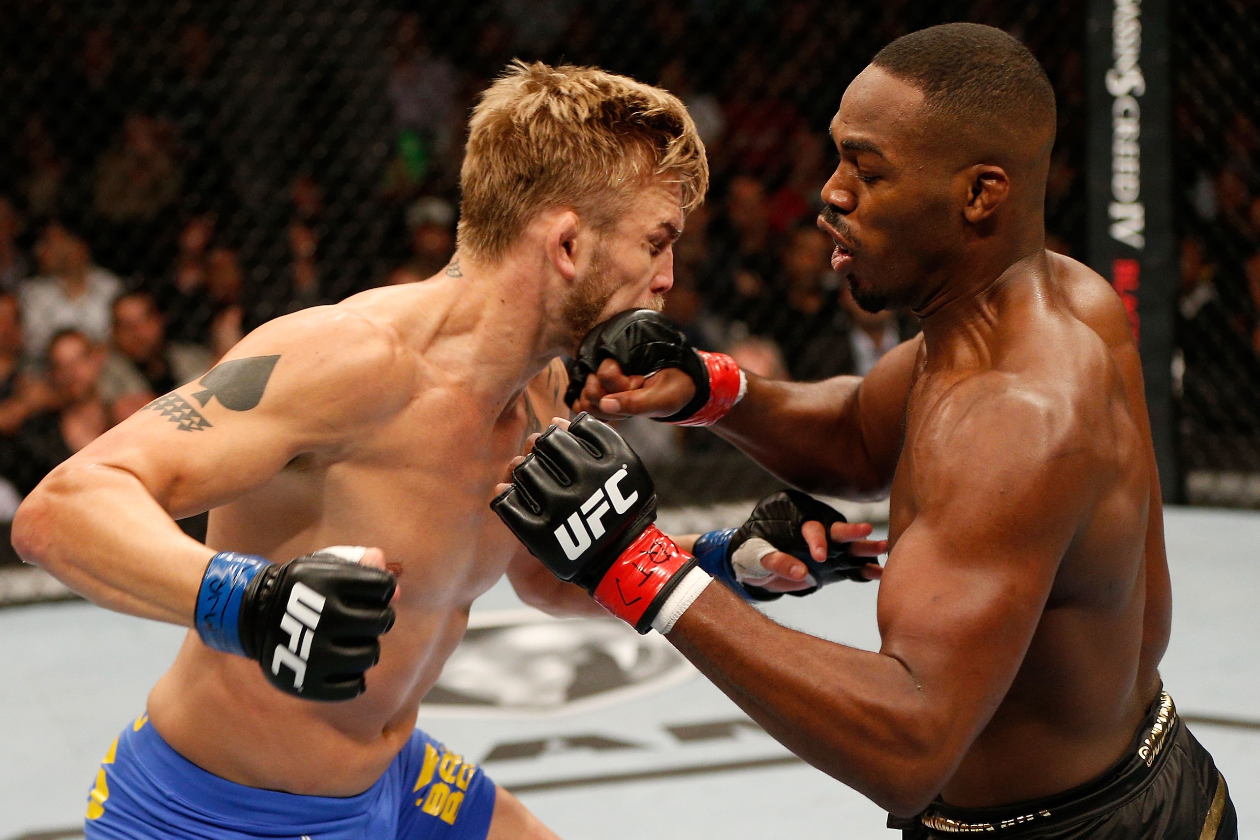 TORONTO, CANADA - SEPTEMBER 21:  (L-R) Alexander 'The Mauler' Gustafsson and Jon 'Bones' Jones exchange punches in their UFC light heavyweight championship bout at the Air Canada Center on September 21, 2013 in Toronto, Ontario, Canada. (Photo by Josh Hed