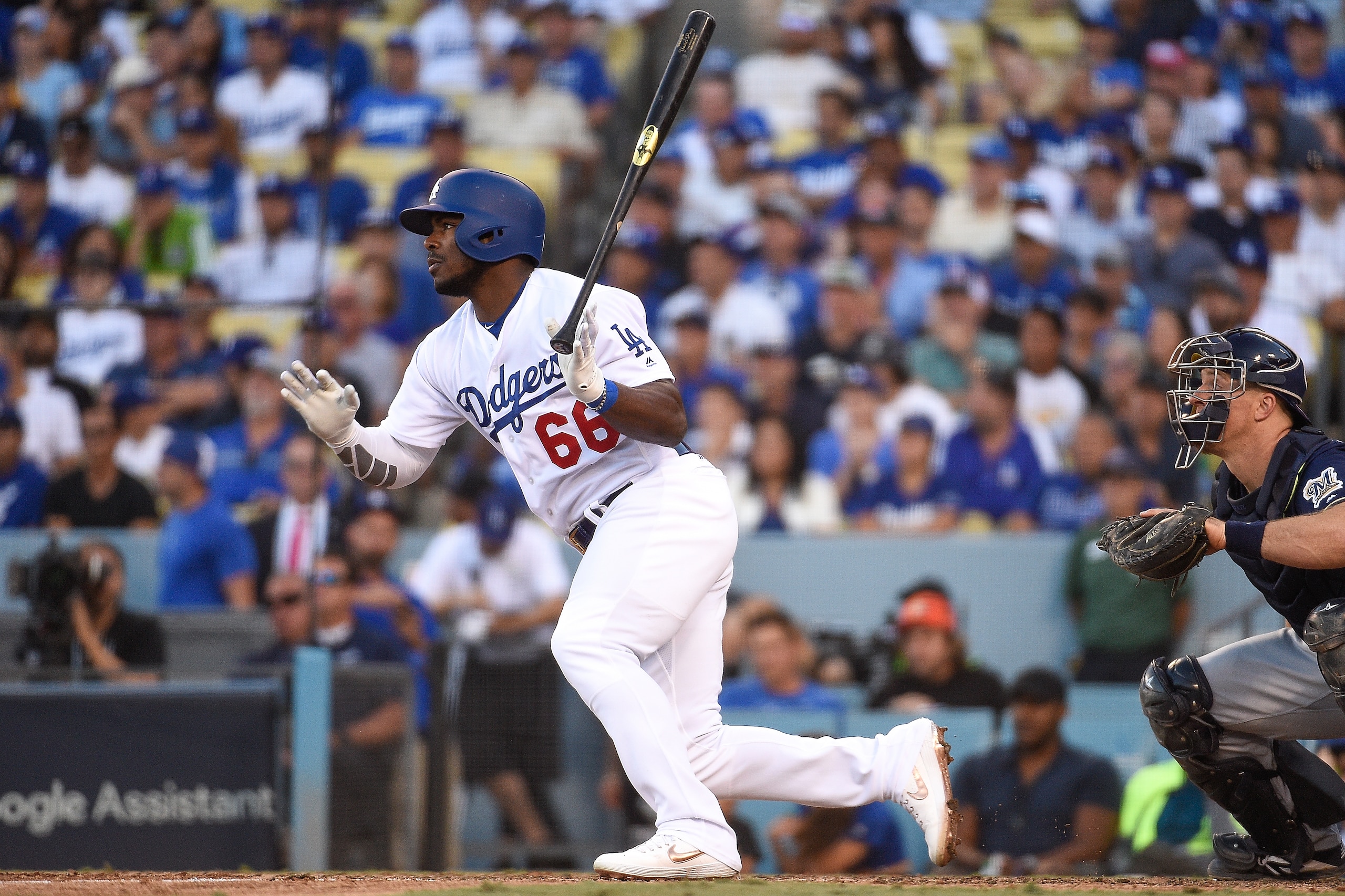LOS ANGELES, CA - OCTOBER 17: Yasiel Puig #66 of the Los Angeles Dodgers hits a double during the eighth inning against the Milwaukee Brewers in Game Five of the National League Championship Series at Dodger Stadium on October 17, 2018 in Los Angeles, Ca LOS ANGELES, CA - OCTOBER 17: Yasiel Puig #66 of the Los Angeles Dodgers hits a double during the eighth inning against the Milwaukee Brewers in Game Five of the National League Championship Series at Dodger Stadium on October 17, 2018 in Los Angeles, Ca
