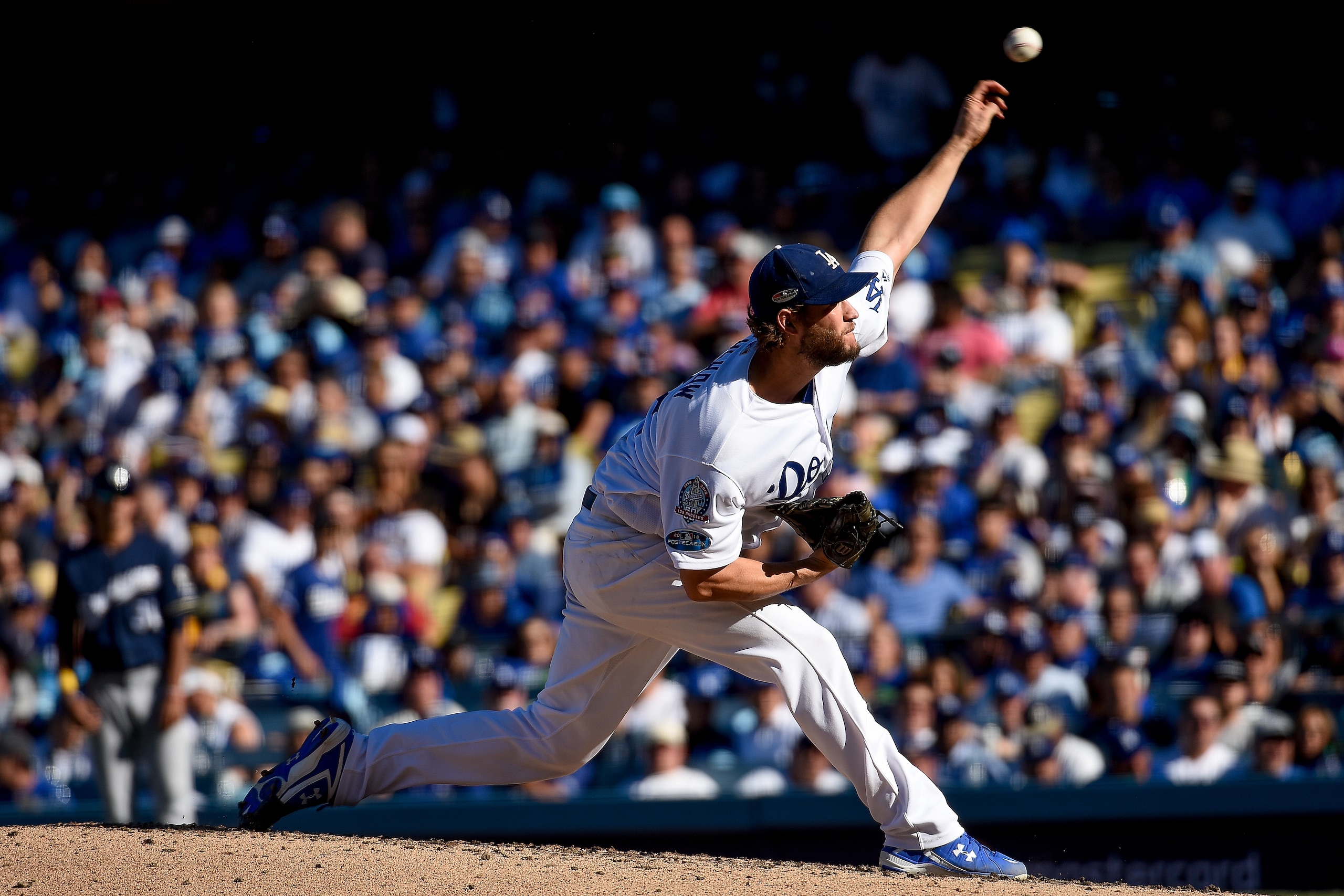 LOS ANGELES, CA - OCTOBER 17:  Clayton Kershaw #22 of the Los Angeles Dodgers delivers a pitch in the fourth inning against the Milwaukee Brewers in Game Five of the National League Championship Series at Dodger Stadium on October 17, 2018 in Los Angeles,