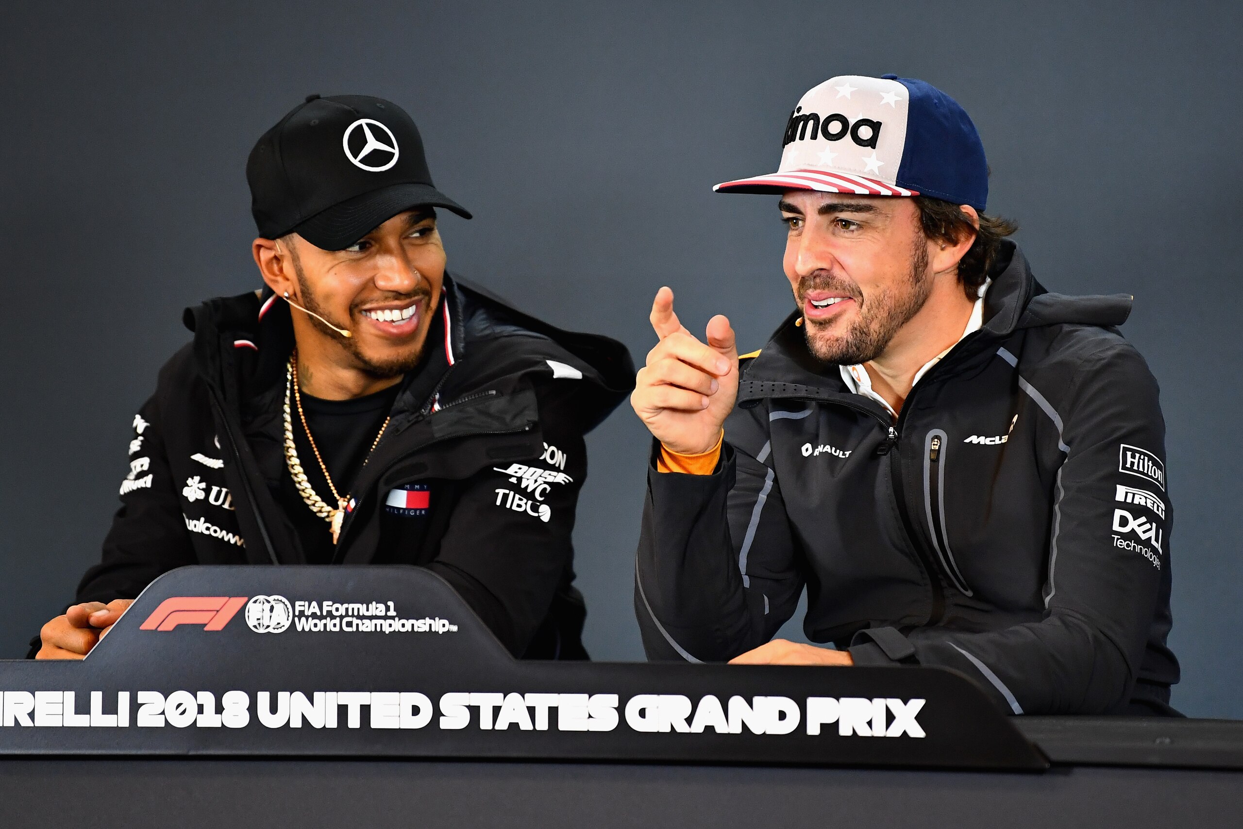 AUSTIN, TX - OCTOBER 18:  Lewis Hamilton of Great Britain and Mercedes GP and Fernando Alonso of Spain and McLaren F1 talk in the Drivers Press Conference during previews ahead of the United States Formula One Grand Prix at Circuit of The Americas on Octo
