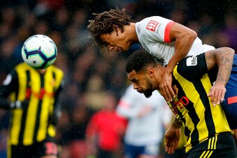 Bournemouth's Dutch defender Nathan Ake (top) vies to header the ball with Watford's English striker Andre Gray during the English Premier League football match between Watford and Bournemouth at Vicarage Road Stadium in Watford, north of London on Octobe